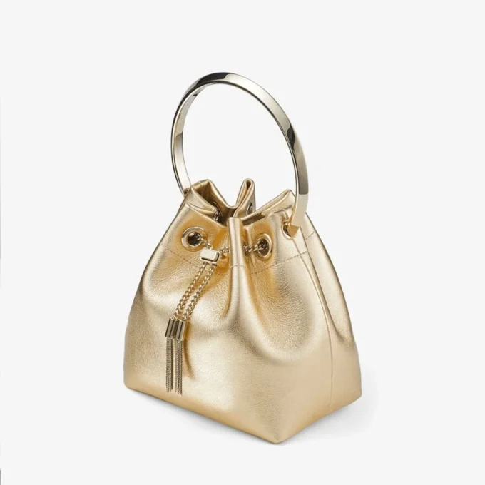 Bon Bon guldmetallisk nappaväska med metallhandtag Bon Bon guldmetallisk nappaväska med metallhandtag