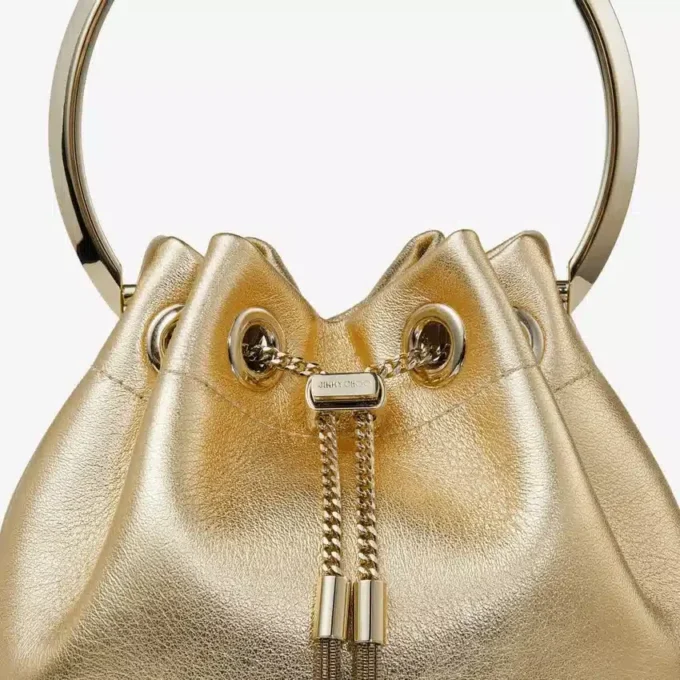 Bon Bon guldmetallisk nappaväska med metallhandtag Bon Bon guldmetallisk nappaväska med metallhandtag