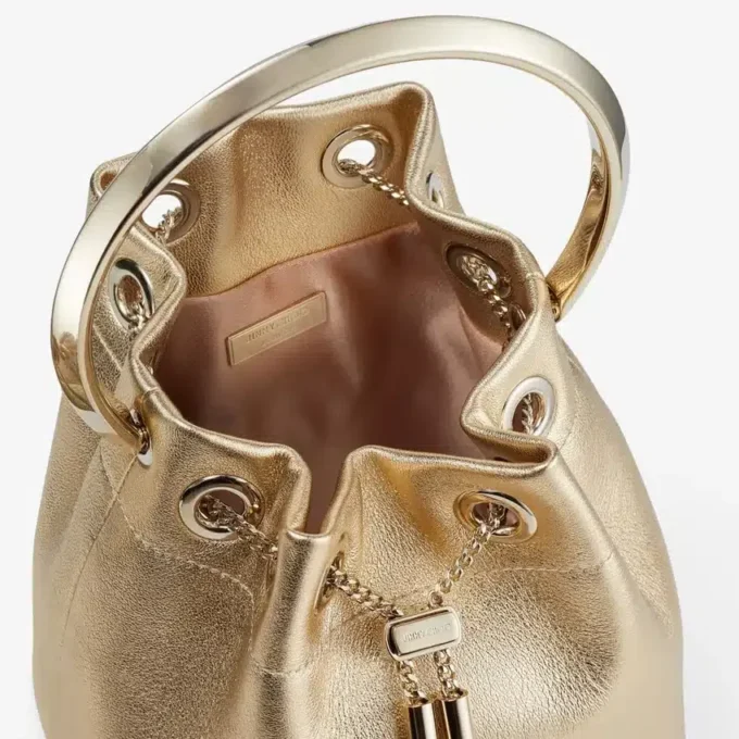 Bon Bon guldmetallisk nappaväska med metallhandtag Bon Bon guldmetallisk nappaväska med metallhandtag