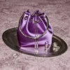 Bon Bon Violet Orchid satinhandväska med metallarmband