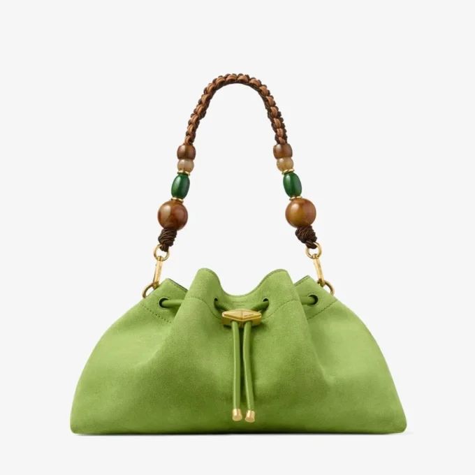Cinch Medium Clover – axelväska i mocka med flätad pärlrem Cinch Medium Clover – axelväska i mocka med flätad pärlrem