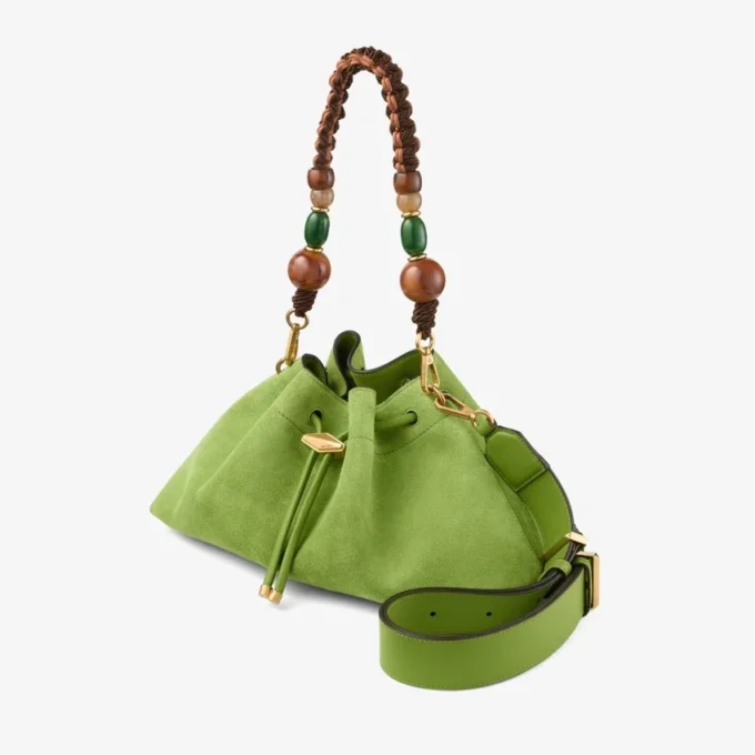 Cinch Medium Clover – axelväska i mocka med flätad pärlrem Cinch Medium Clover – axelväska i mocka med flätad pärlrem