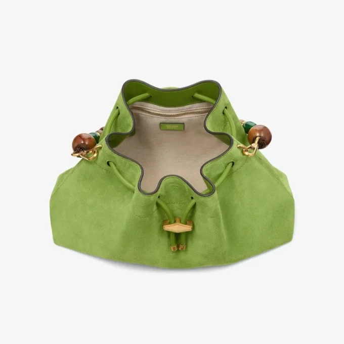 Cinch Medium Clover – axelväska i mocka med flätad pärlrem Cinch Medium Clover – axelväska i mocka med flätad pärlrem