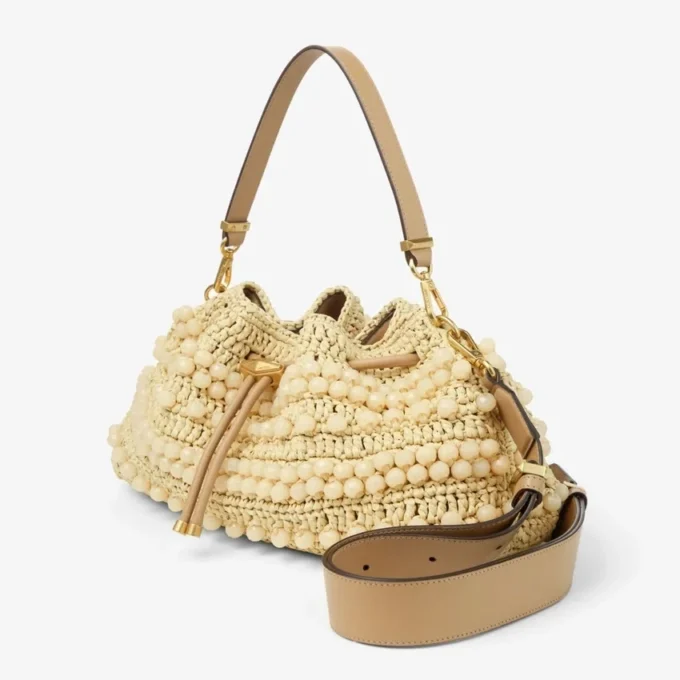 Cinch Medium naturfärgad och cappuccinofärgad raffia-bucketväska med pärlor och slätt kalvskinn Cinch Medium naturfärgad och cappuccinofärgad raffia-bucketväska med pärlor och slätt kalvskinn