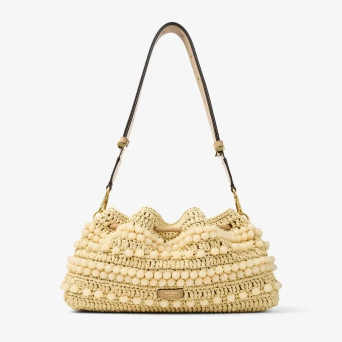 Cinch Medium naturfärgad och cappuccinofärgad raffia-bucketväska med pärlor och slätt kalvskinn Cinch Medium naturfärgad och cappuccinofärgad raffia-bucketväska med pärlor och slätt kalvskinn