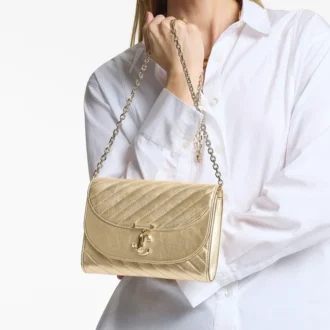 Curve Clutch Glänsande guldfärgad quiltad metallisk läderclutch med kedja