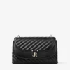 Curve Cross Body Medium Svart quiltad crossbody-väska i bikerläder