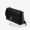 Curve Cross Body Medium Svart quiltad crossbody-väska i bikerläder