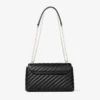 Curve Cross Body Medium Svart quiltad crossbody-väska i bikerläder