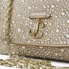Curve Crossbody Small – guldskimrande crossbody-väska i mocka med hotfix-kristaller Curve Crossbody Small – guldskimrande crossbody-väska i mocka med hotfix-kristaller