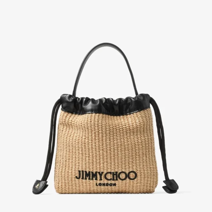 Dragsko-påse med handtag i naturfärgad och svart mjuk raffia med läderkant Dragsko-påse med handtag i naturfärgad och svart mjuk raffia med läderkant