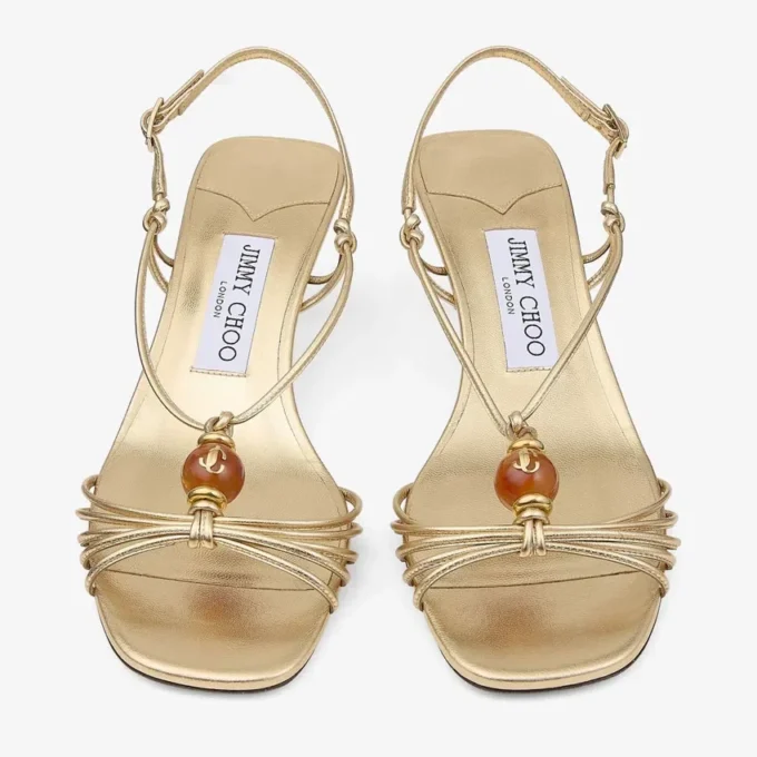 Lova 50 sandaler i guldmetalliskt nappaläder med pärlor Lova 50 sandaler i guldmetalliskt nappaläder med pärlor