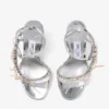 Lula 100 silver- och macaronfärgade sandaler i Liquid Metal-läder med sammetrosetter