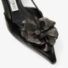 Mimmi Sling Back 50 Svarta slingbacks i glänsande nappaläder med corsage i nappaspets
