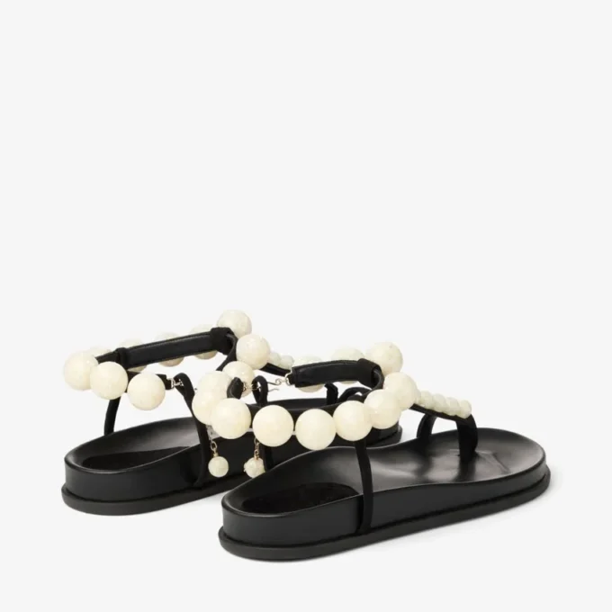 Miro platta svarta mockasandaler med pärlemorsfärger