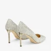 Romy 85 Pumps i grovt glittertyg i champagnefärg med spetsig tå Romy 85 Pumps i grovt glittertyg i champagnefärg med spetsig tå