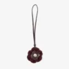 Stickad blomsterberlock Mörkröd stickad blomsterberlock i ull med läderdetaljer Stickad blomsterberlock Mörkröd stickad blomsterberlock i ull med läderdetaljer