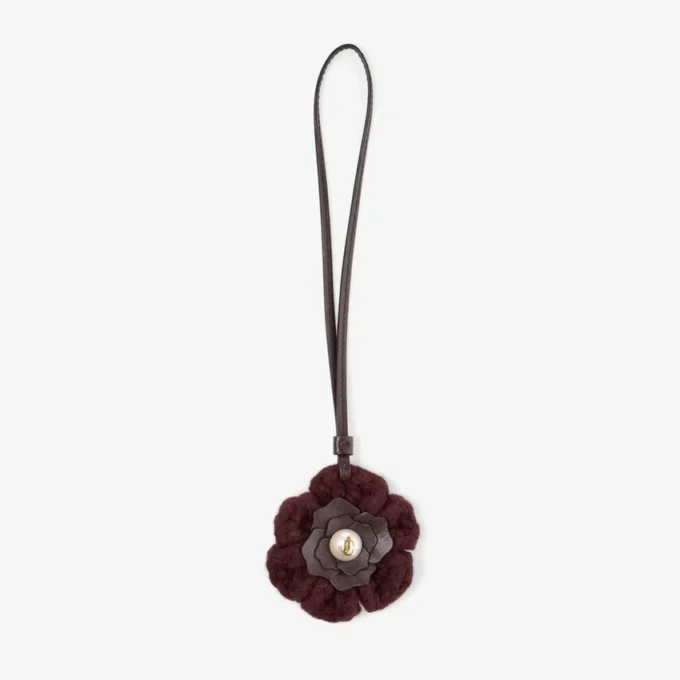 Stickad blomsterberlock Mörkröd stickad blomsterberlock i ull med läderdetaljer Stickad blomsterberlock Mörkröd stickad blomsterberlock i ull med läderdetaljer