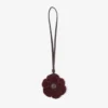 Stickad blomsterberlock Mörkröd stickad blomsterberlock i ull med läderdetaljer Stickad blomsterberlock Mörkröd stickad blomsterberlock i ull med läderdetaljer