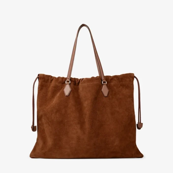 Stor toteväska i tanfärgat mocka och slätt kalvskinn med dragsko och Jimmy Choo-logotyp Stor toteväska i tanfärgat mocka och slätt kalvskinn med dragsko och Jimmy Choo-logotyp